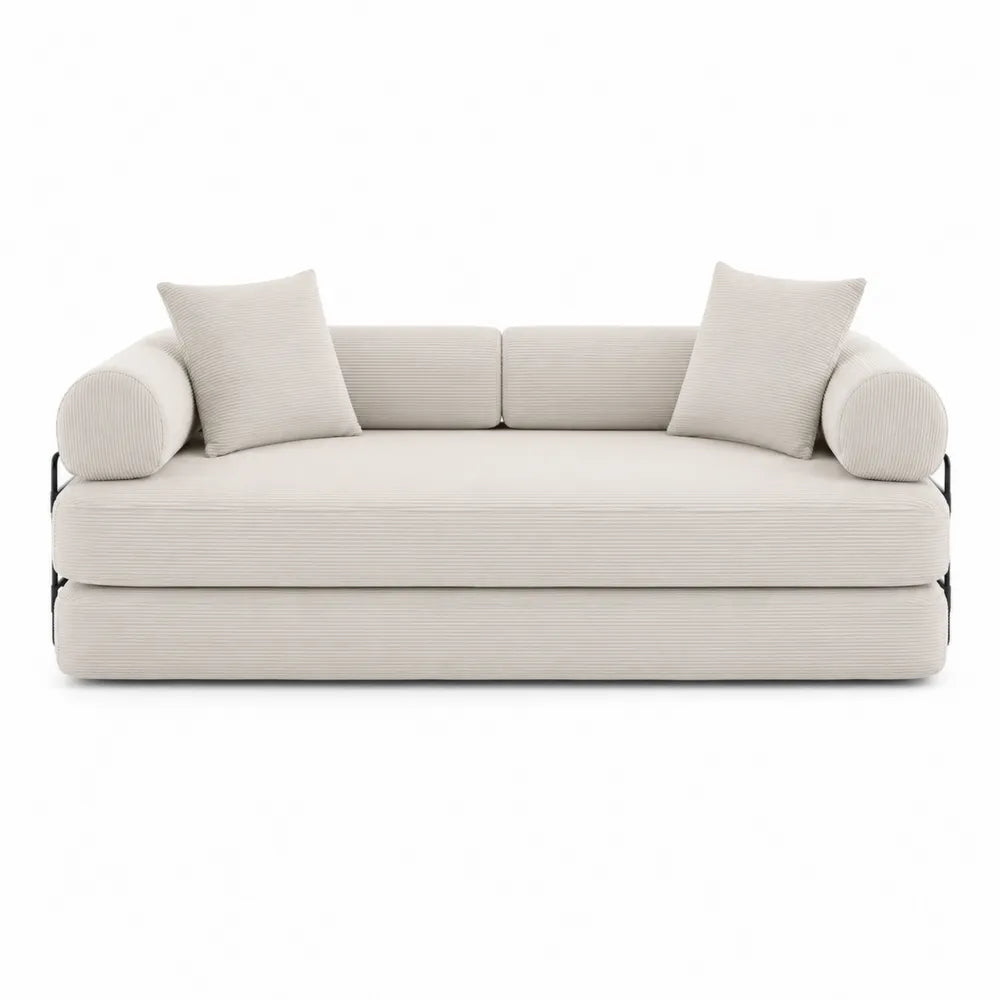 Sofá cama de pana beige con cojines