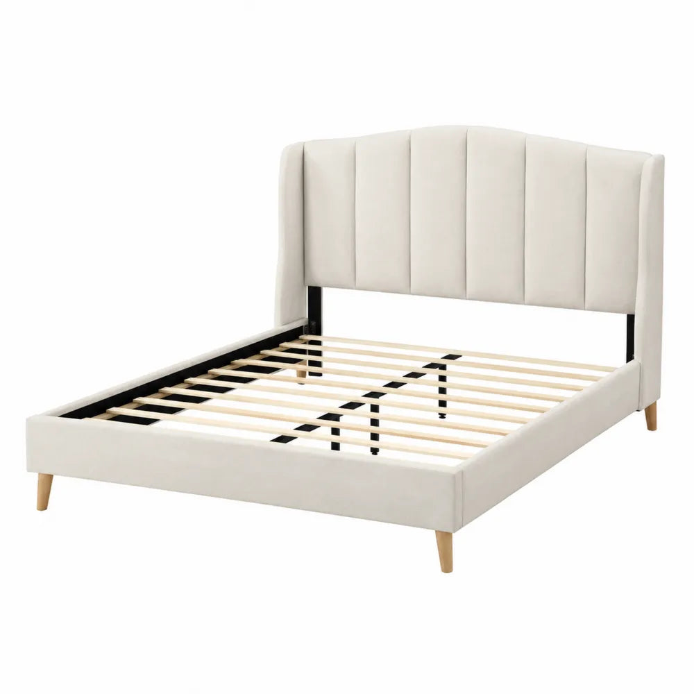 Cama tapizada grande beige con cabecero acolchado, estructura de acero y patas de madera